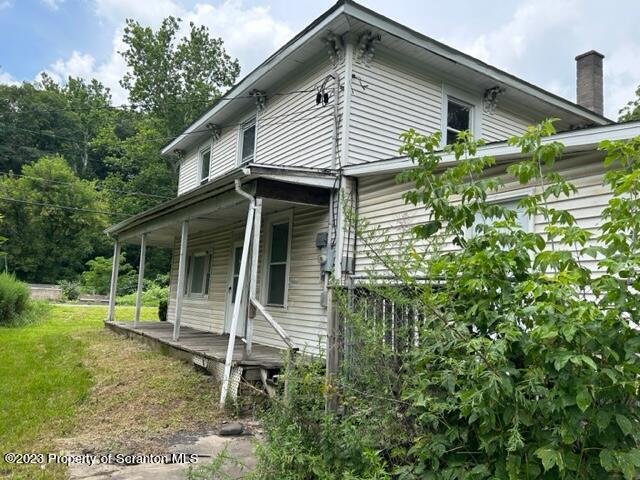 112 Mowry Road Meshoppen, PA 18630 - Photo 22 of 24 a front view of a house with garden