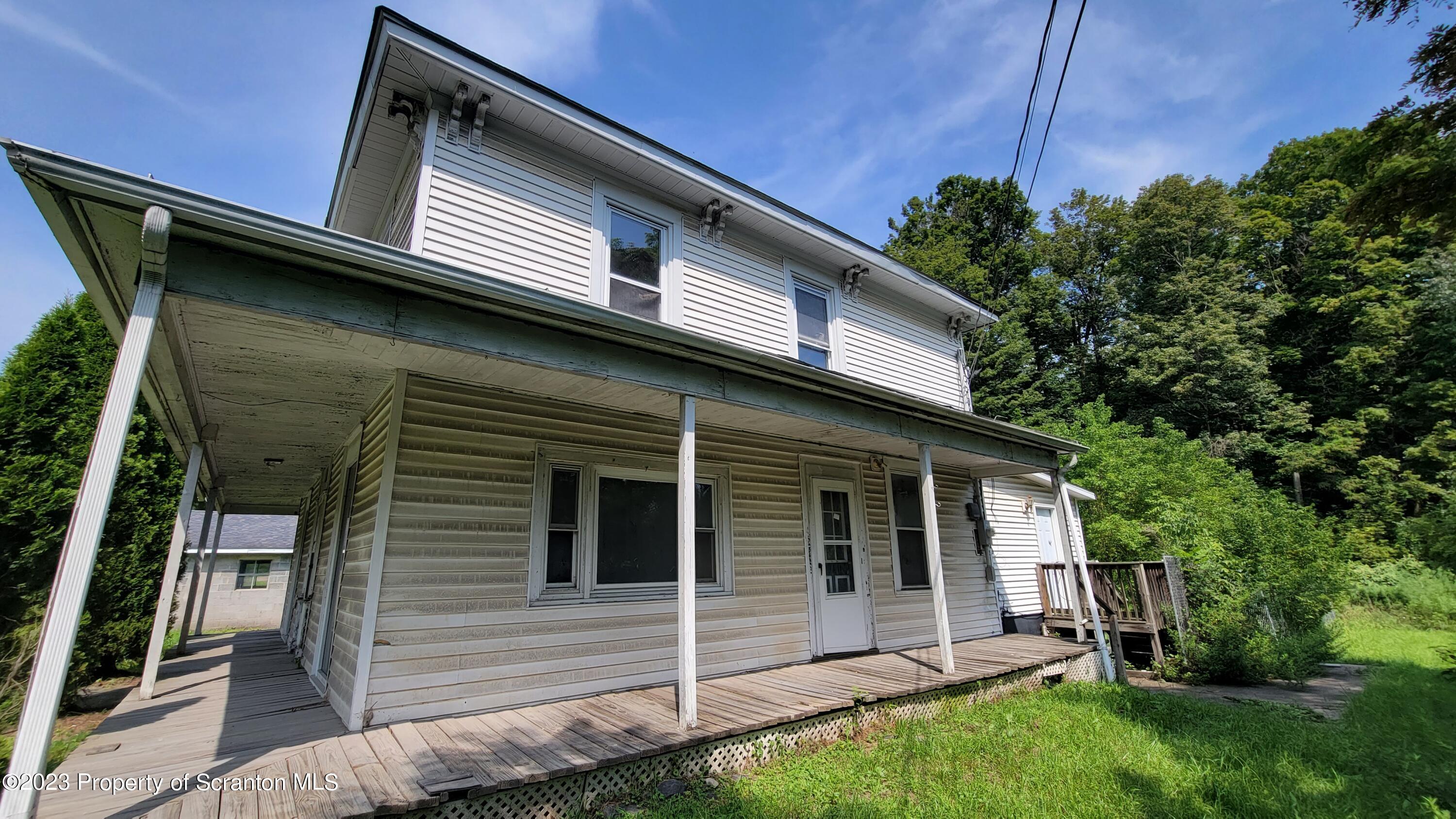 112 Mowry Road Meshoppen, PA 18630 - Photo 3 of 24 a view of house with backyard