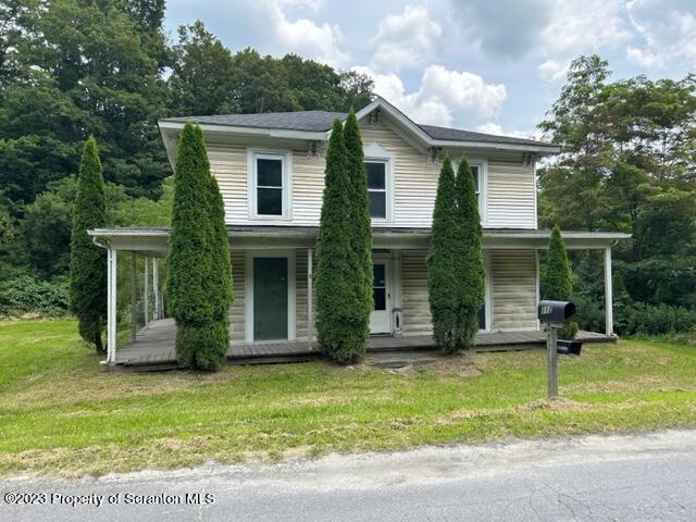 112 Mowry Road Meshoppen, PA 18630 - Photo 5 of 24 a view of a house with a yard and plants