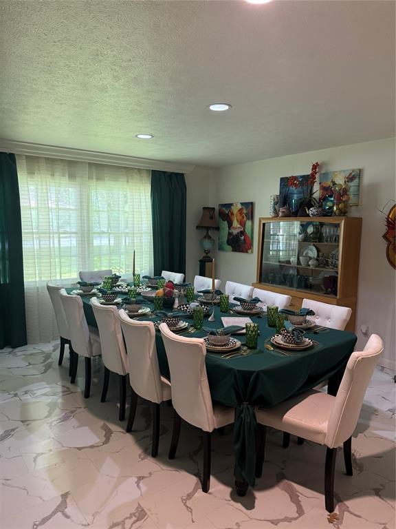 1650 Azteca Drive Fort Worth, TX 76112 - Photo 16 of 37 a view of a dining room with furniture