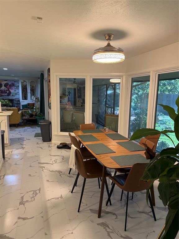 1650 Azteca Drive Fort Worth, TX 76112 - Photo 20 of 37 a view of a dining room with furniture window and outside view