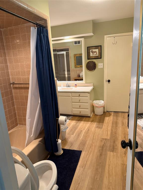 1650 Azteca Drive Fort Worth, TX 76112 - Photo 29 of 37 a bathroom with a granite countertop sink toilet and shower