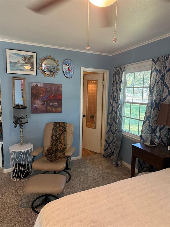 1650 Azteca Drive Fort Worth, TX 76112 - Photo 31 of 37 a living room with furniture windows and a flat screen tv