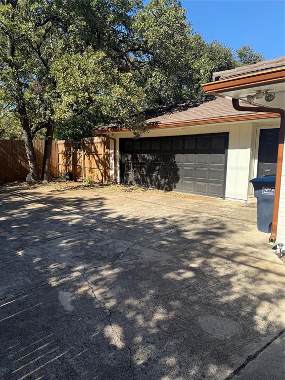 1650 Azteca Drive Fort Worth, TX 76112 - Photo 33 of 37 a front view of a house with a yard