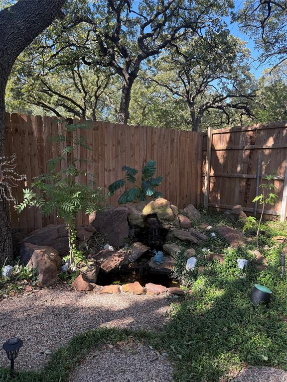 1650 Azteca Drive Fort Worth, TX 76112 - Photo 36 of 37 a backyard of a house with lots of green space