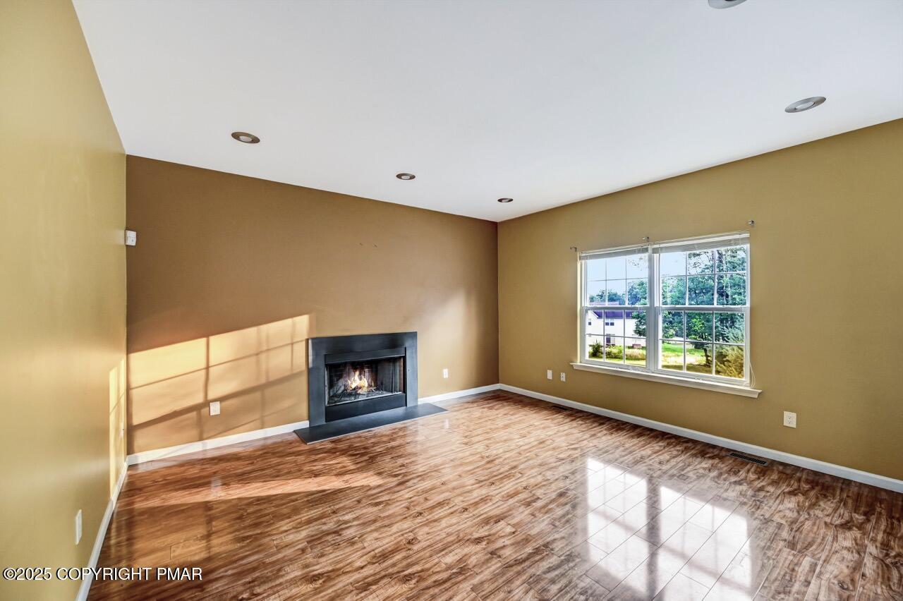 115 Daffodil Drive East Stroudsburg, PA 18301 - Photo 17 of 59 a view of an empty room with a window and fireplace