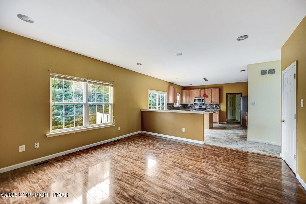 115 Daffodil Drive East Stroudsburg, PA 18301 - Photo 18 of 59 a view of a kitchen with wooden floor and a window