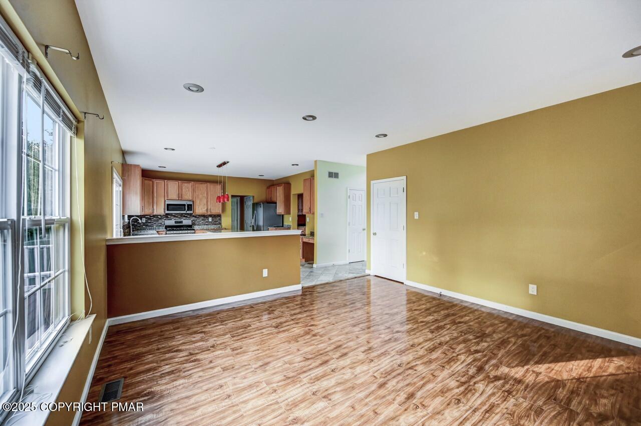 115 Daffodil Drive East Stroudsburg, PA 18301 - Photo 19 of 59 a view of kitchen and wooden floor