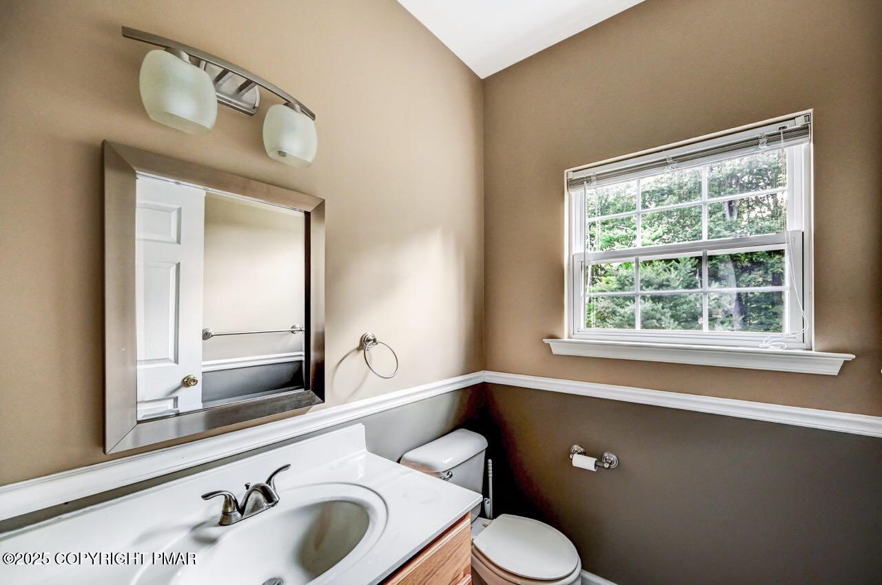 115 Daffodil Drive East Stroudsburg, PA 18301 - Photo 20 of 59 a bathroom with a toilet sink and mirror