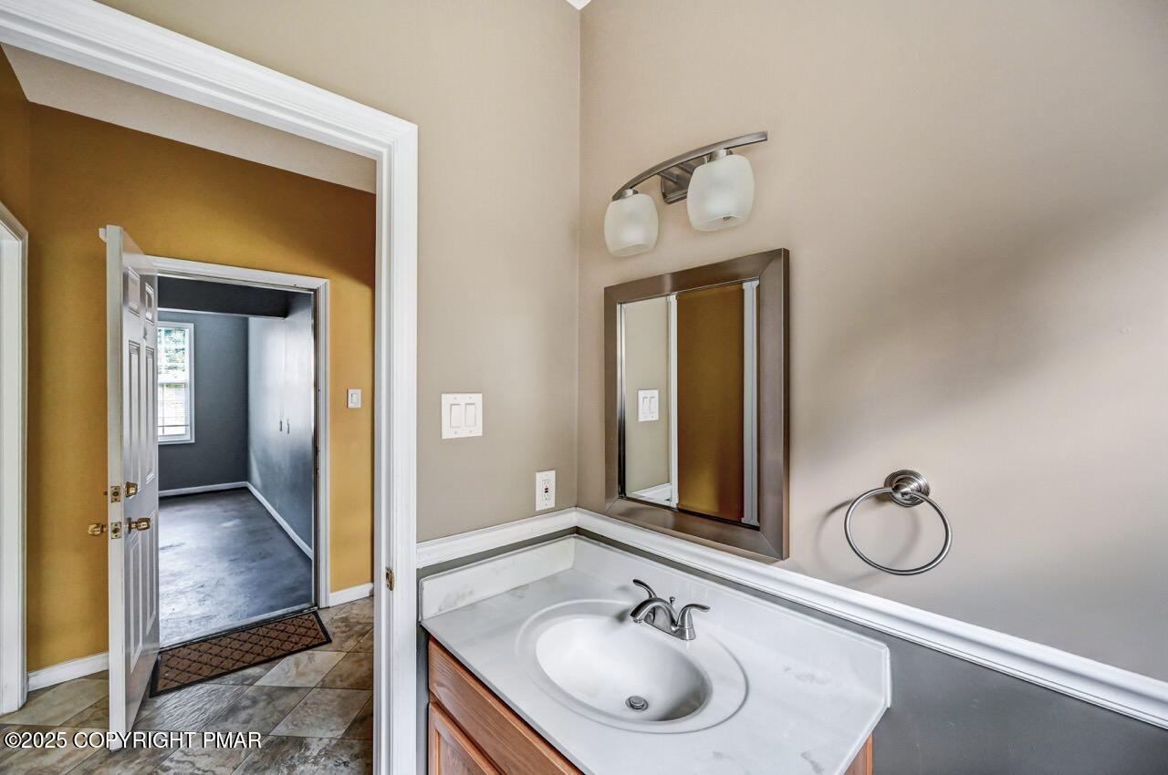 115 Daffodil Drive East Stroudsburg, PA 18301 - Photo 21 of 59 a bathroom with a sink and a mirror