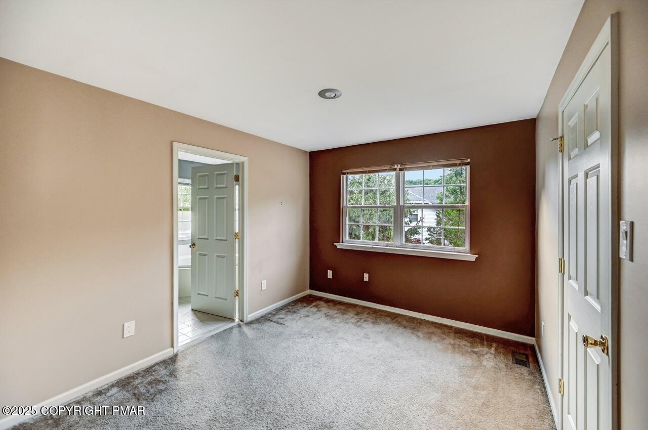 115 Daffodil Drive East Stroudsburg, PA 18301 - Photo 29 of 59 an empty room with windows and closet