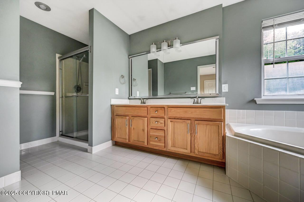 115 Daffodil Drive East Stroudsburg, PA 18301 - Photo 33 of 59 a bathroom with a bathtub sink and mirror