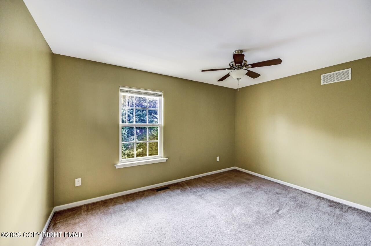 115 Daffodil Drive East Stroudsburg, PA 18301 - Photo 35 of 59 a view of a livingroom with a ceiling fan and window