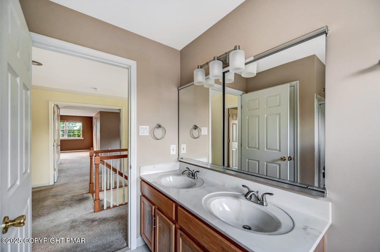 115 Daffodil Drive East Stroudsburg, PA 18301 - Photo 42 of 59 a bathroom with a sink and a mirror