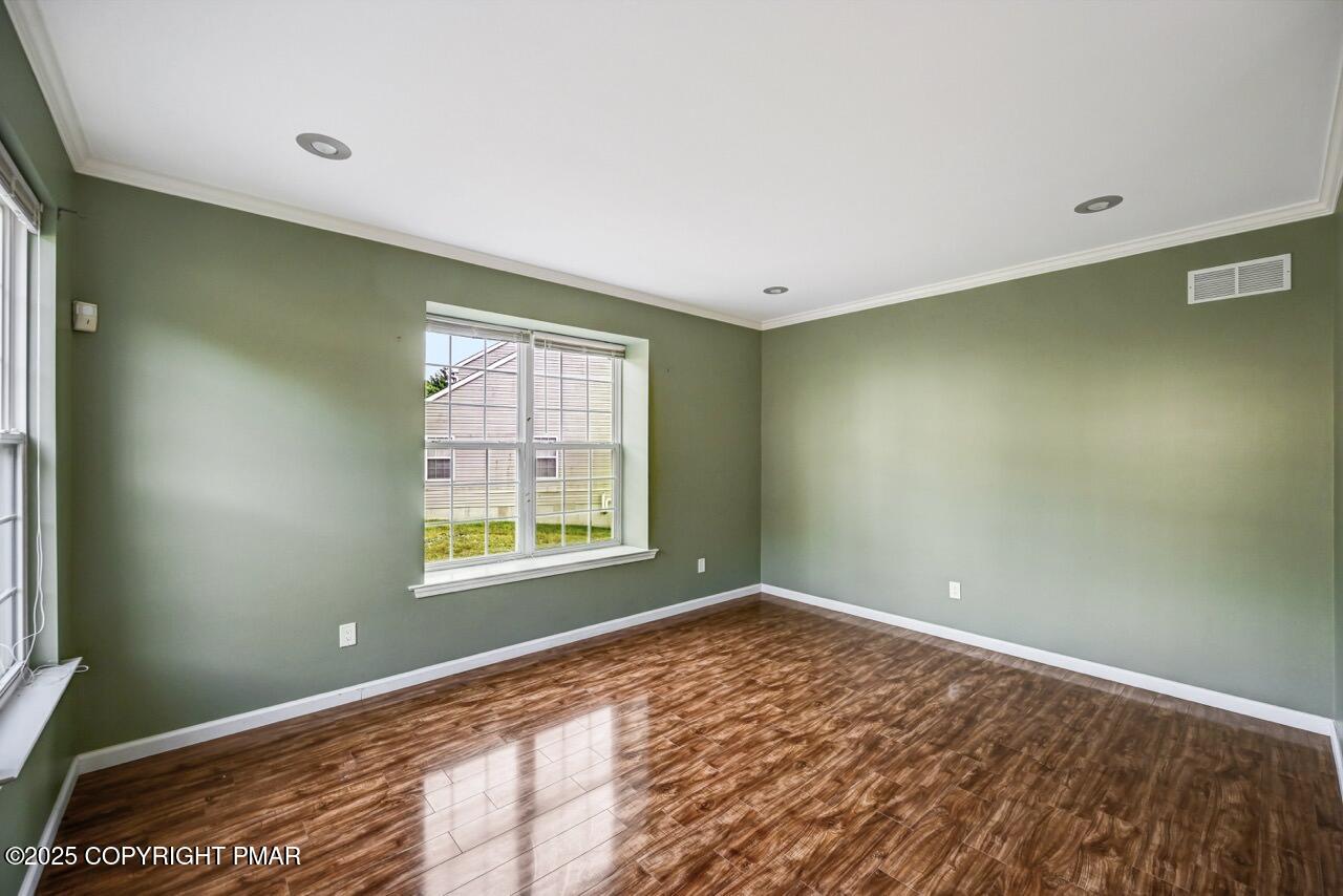 115 Daffodil Drive East Stroudsburg, PA 18301 - Photo 5 of 59 a view of an empty room with a window