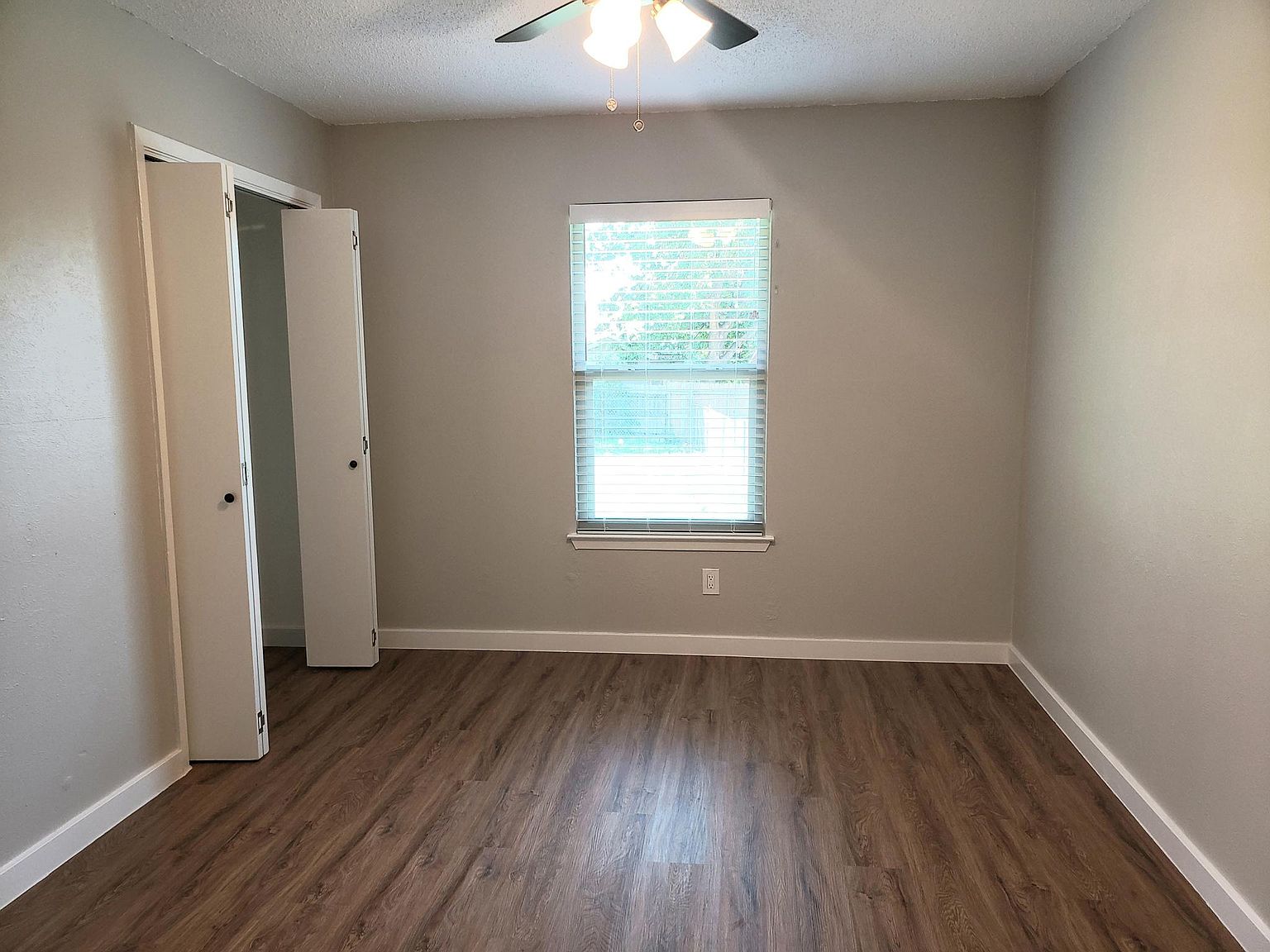 802 Ranch Road, Unit A Georgetown, TX 78628 - Photo 10 of 11 A well-proportioned room with robust plank flooring and a functional window.