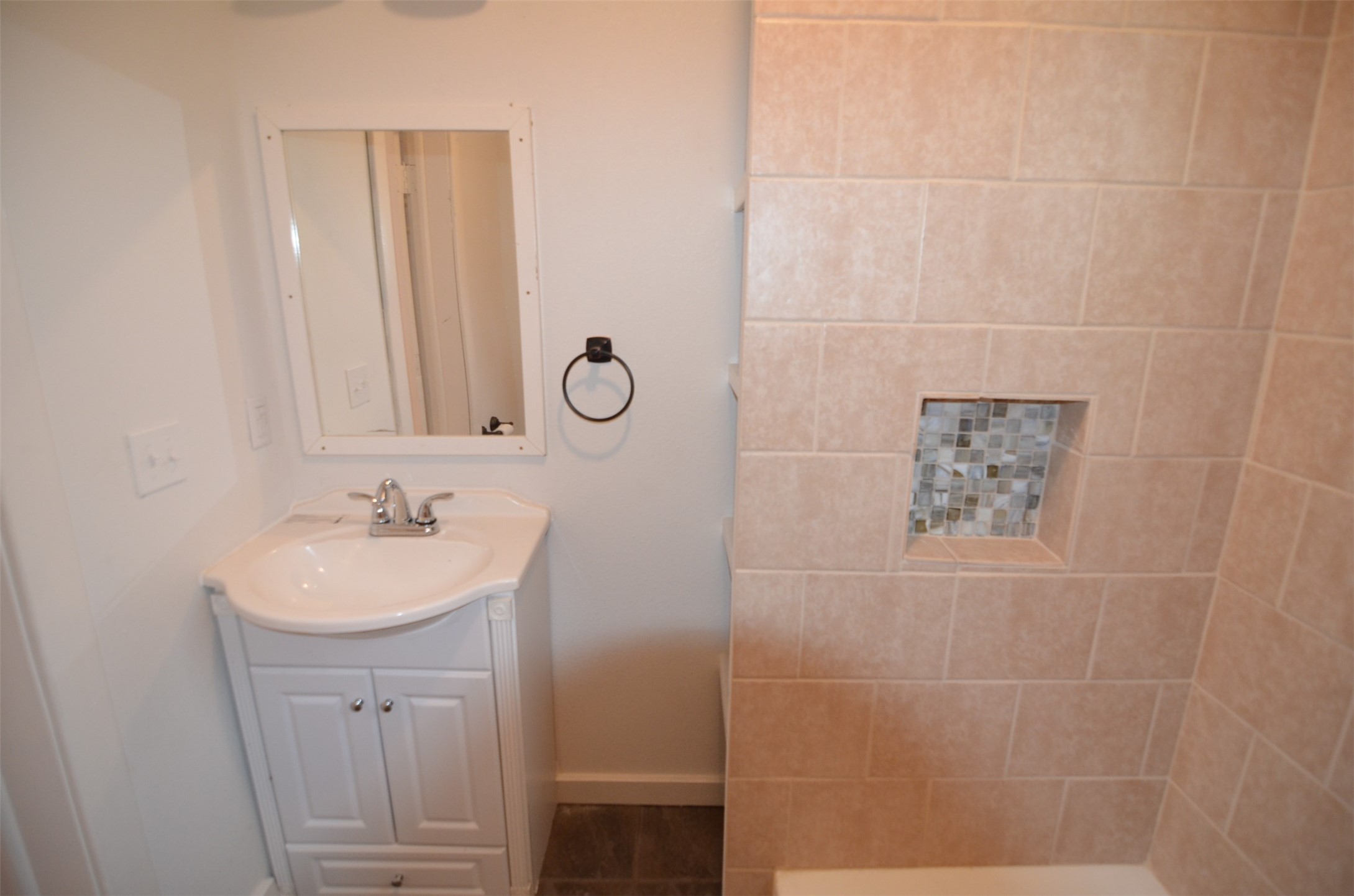 2123 Marion Street, Unit 1 Houston, TX 77009 - Photo 15 of 19 a bathroom with a sink a toilet and a mirror