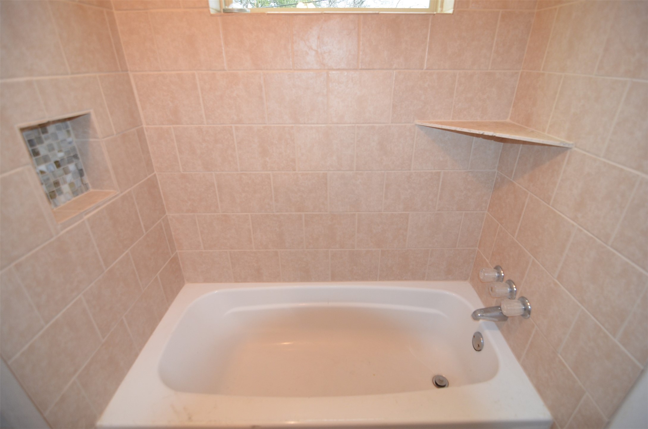 2123 Marion Street, Unit 1 Houston, TX 77009 - Photo 17 of 19 a close up of a bathtub in a bathroom