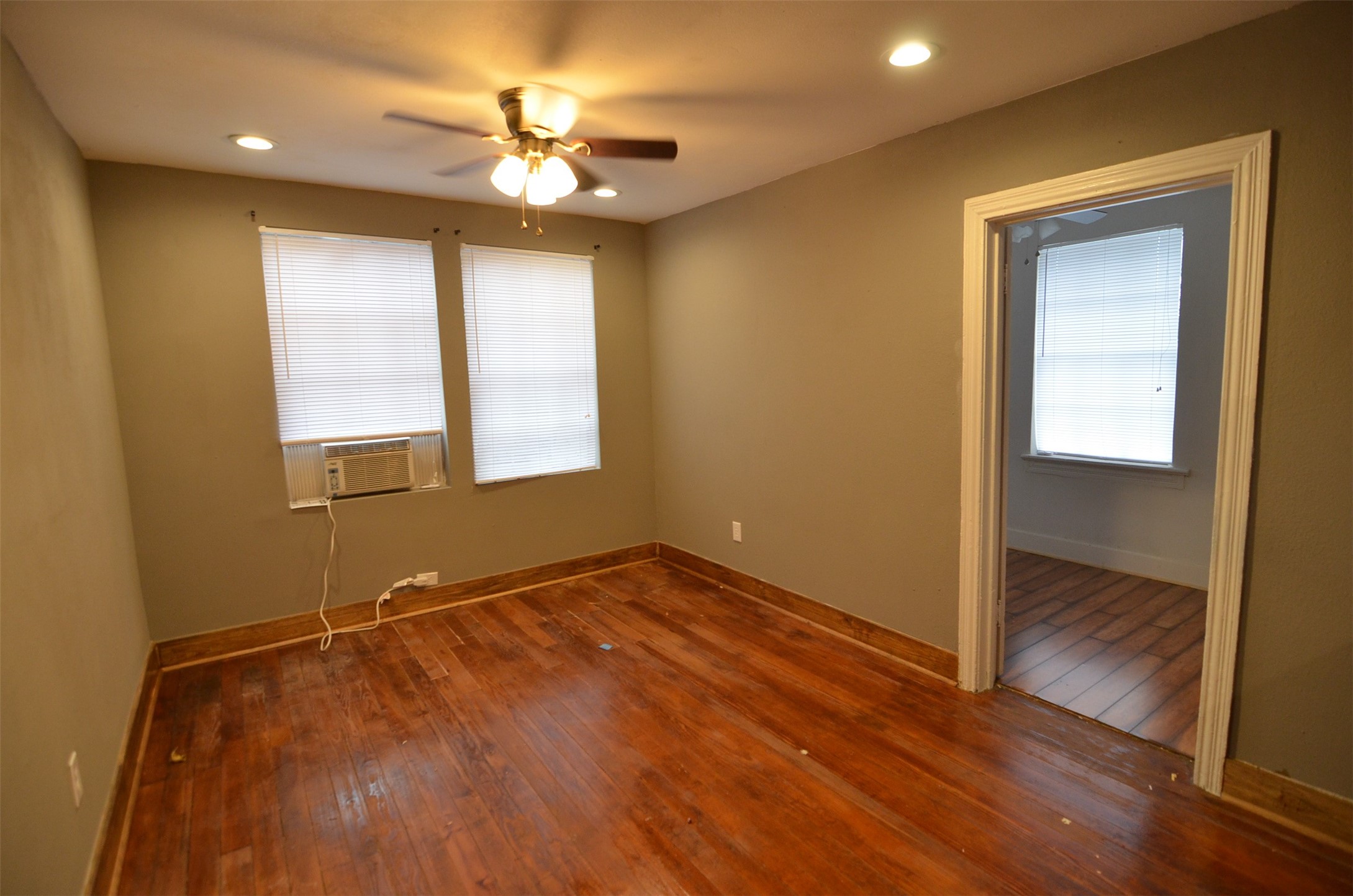 2123 Marion Street, Unit 1 Houston, TX 77009 - Photo 5 of 19 a view of an empty room with wooden floor and a window