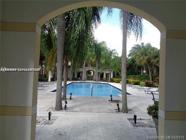 650 South Park Road, Unit 215 Hollywood, FL 33021 - Photo 19 of 24 a view of swimming pool with a patio and backyard