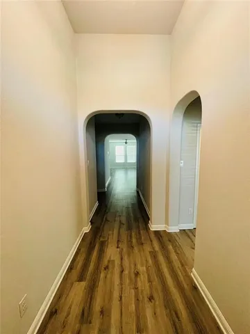 a view of front door with wooden floor