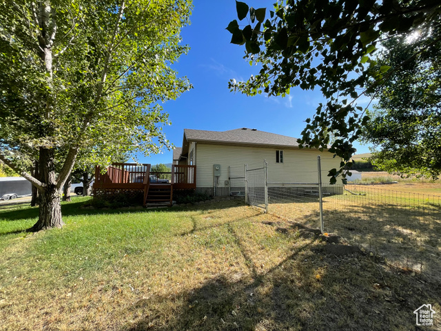 11473 South Dempsey Creek Road Lava Hot Springs, ID 83246 - Photo 43 of 47 Rear view of property with a wooden deck