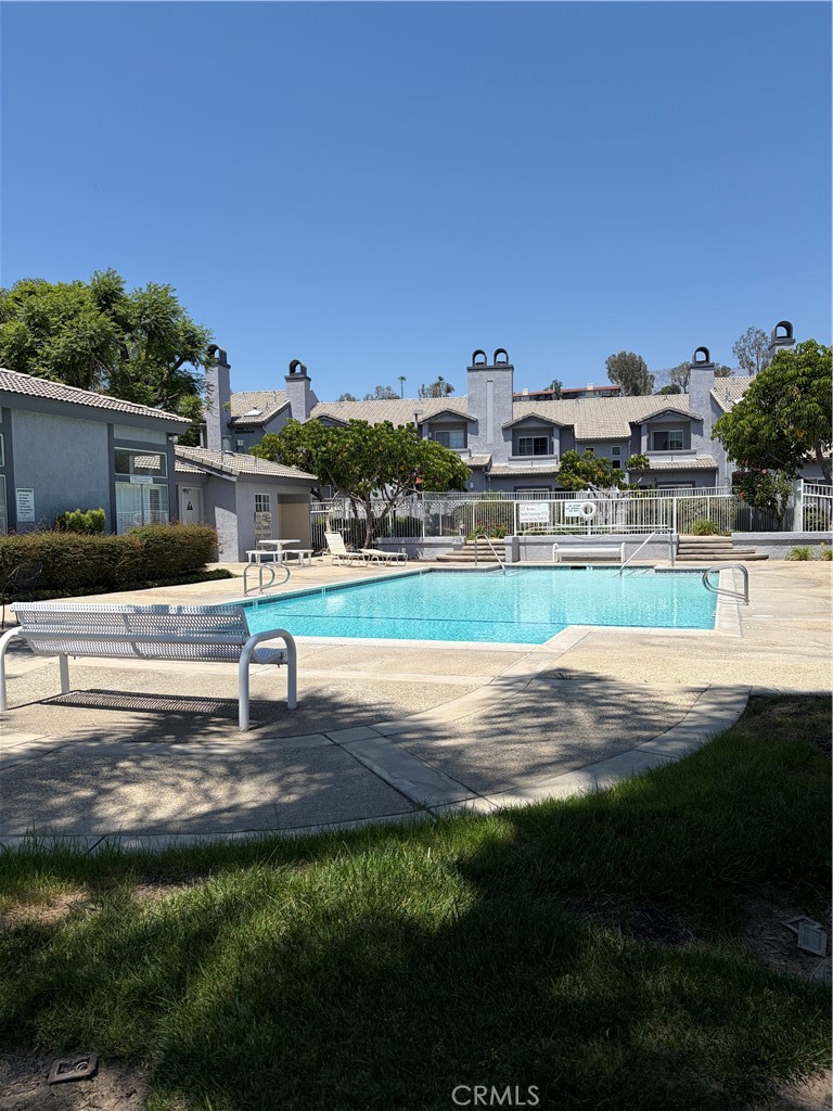 8248 Inglenook Place Rancho Cucamonga, CA 91730 - Photo 9 of 12 a swimming pool with outdoor seating and yard