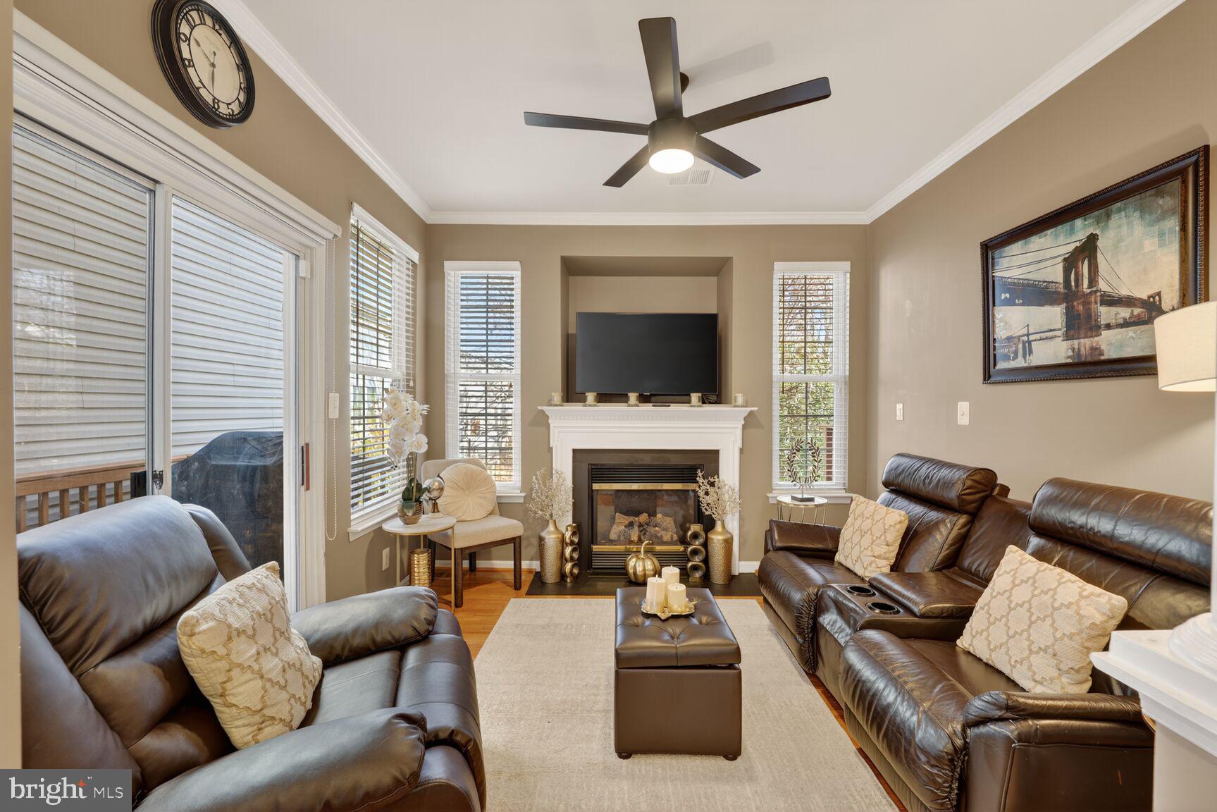 165 Tilden Way Edgewater, MD 21037 - Photo 11 of 22 a living room with furniture a large window and a fireplace