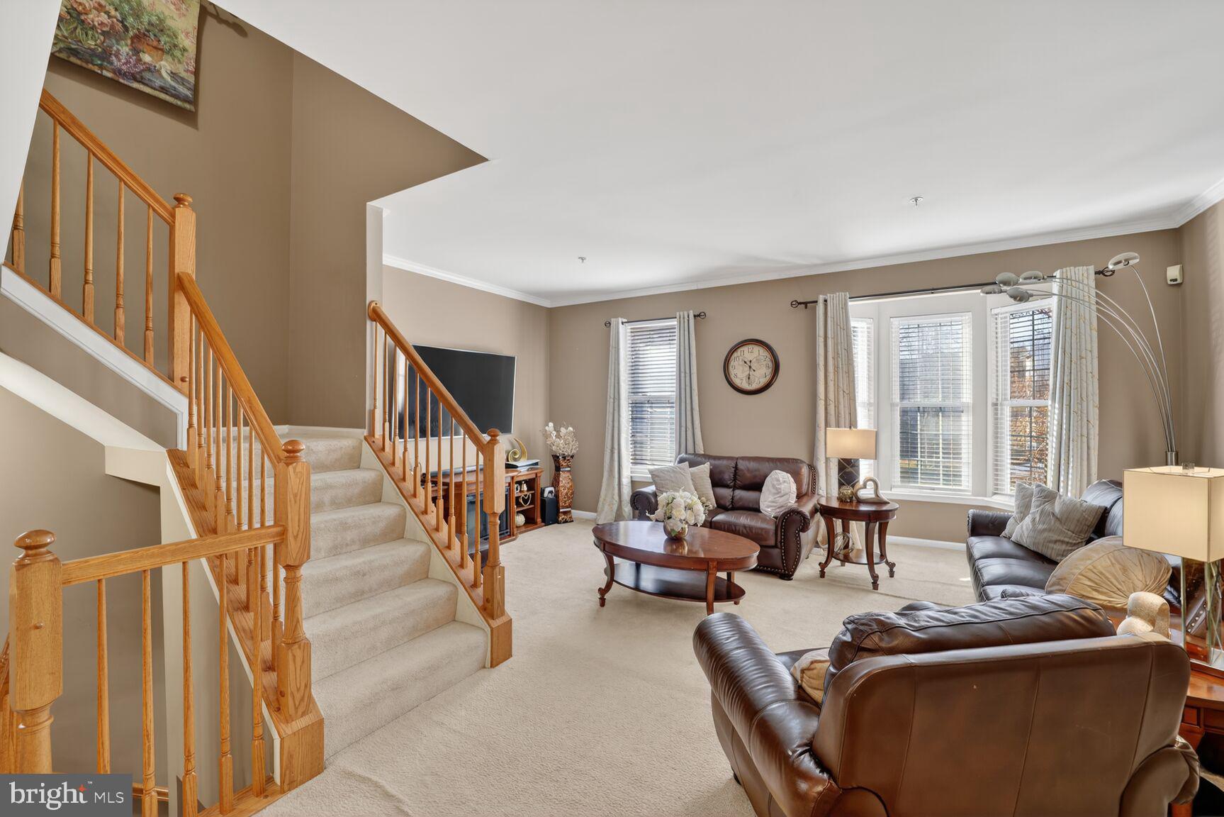 165 Tilden Way Edgewater, MD 21037 - Photo 12 of 22 a living room with furniture and large windows