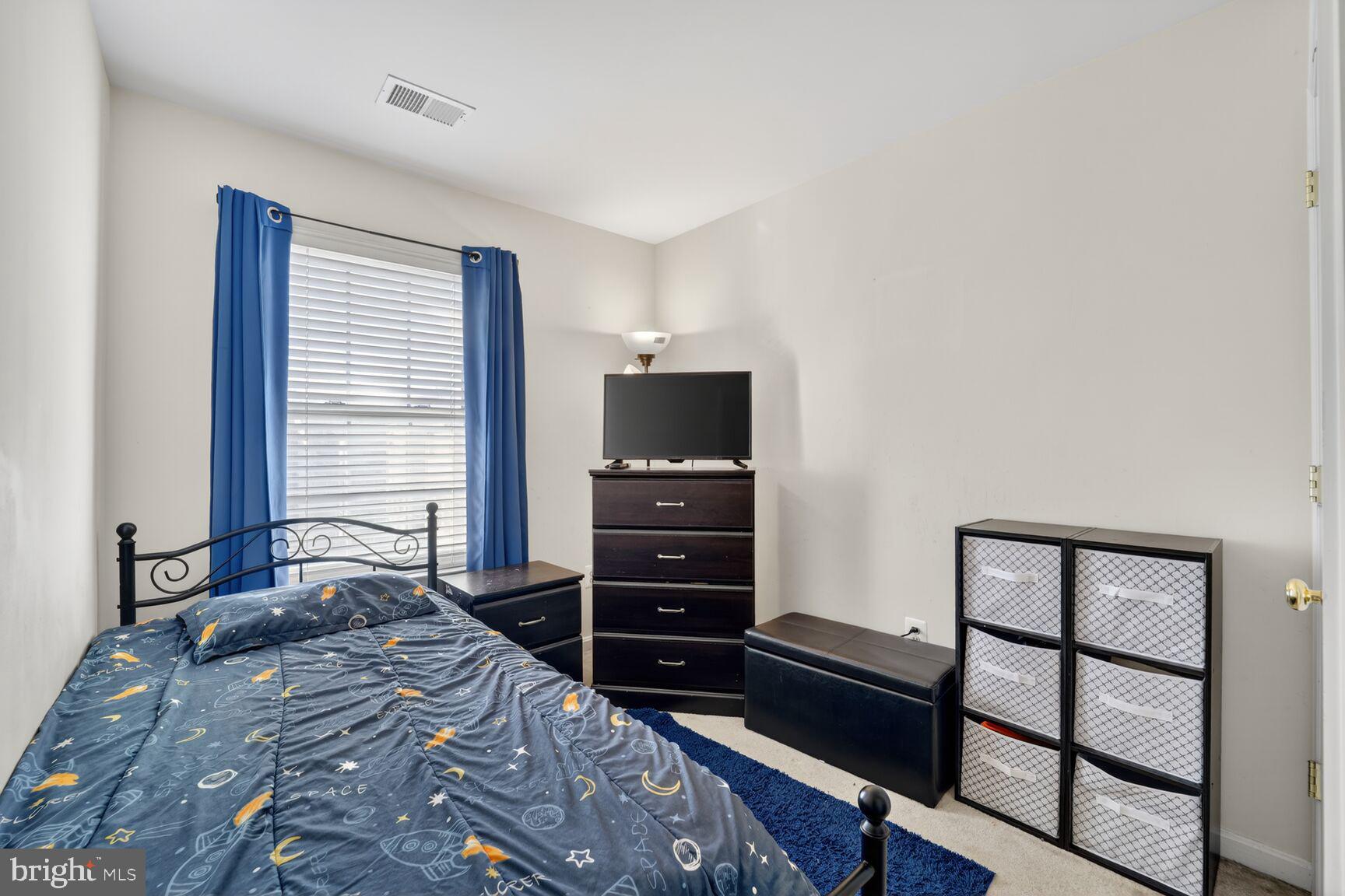 165 Tilden Way Edgewater, MD 21037 - Photo 15 of 22 a bedroom with a bed and a television
