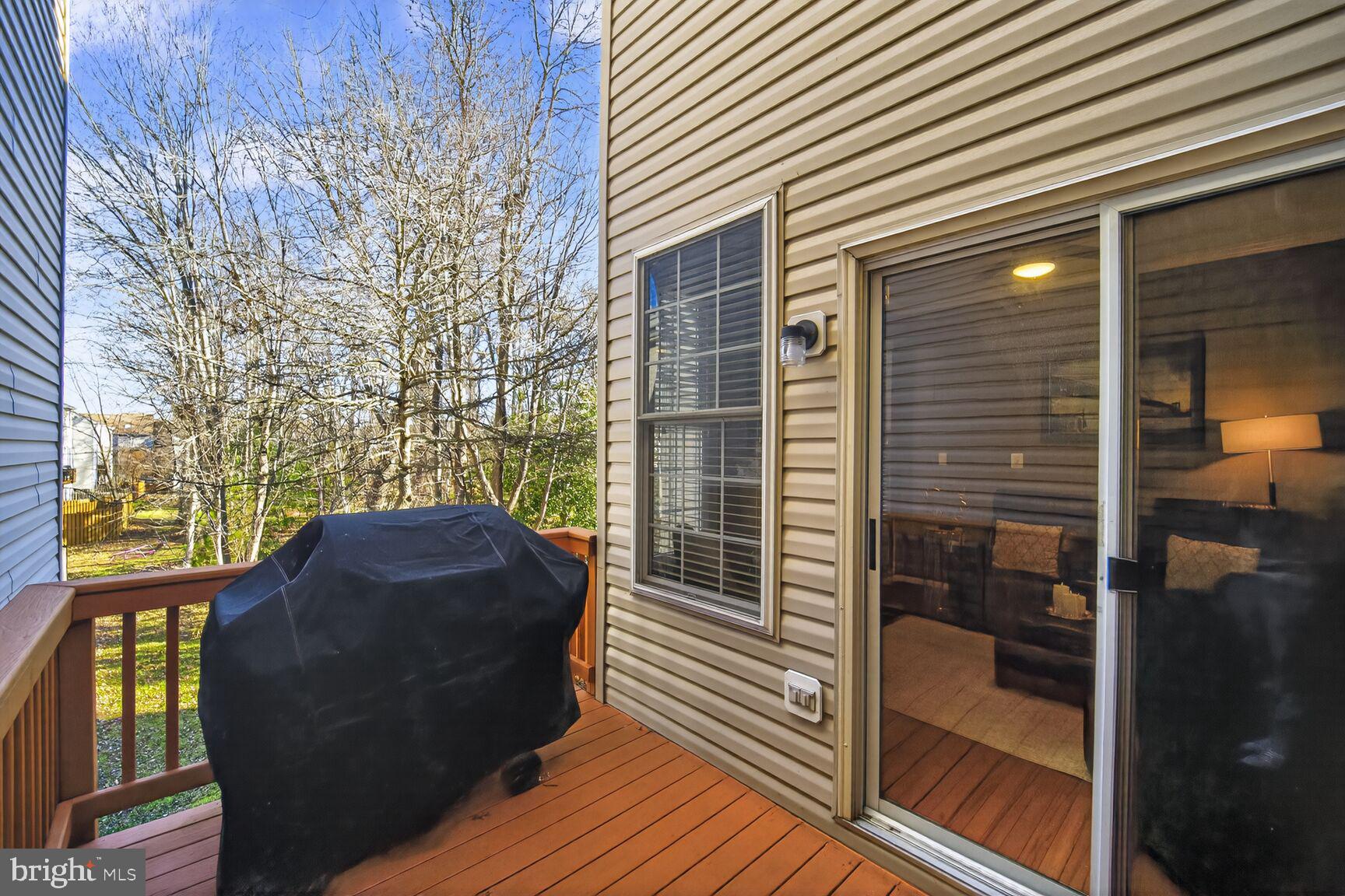 165 Tilden Way Edgewater, MD 21037 - Photo 21 of 22 a view of balcony with wooden floor and a potted plant