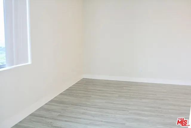 a kitchen with a sink and a stove top oven