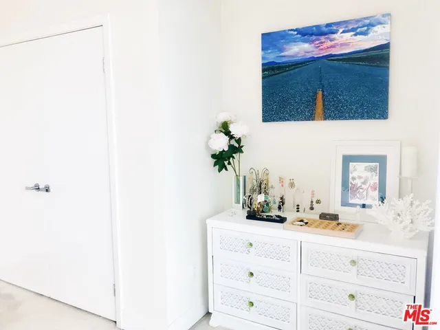 a bedroom with a large bed and a table