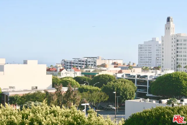 a living room with furniture and flowers