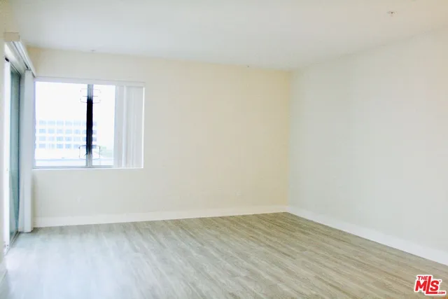 a kitchen with a sink appliances and cabinets