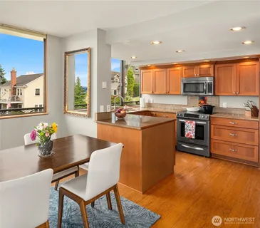 a kitchen with sink cabinets and wooden floor