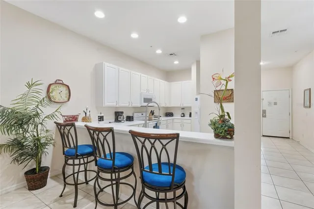 a living room with furniture and flat screen tv
