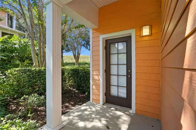 a view of a front door and wooden floor