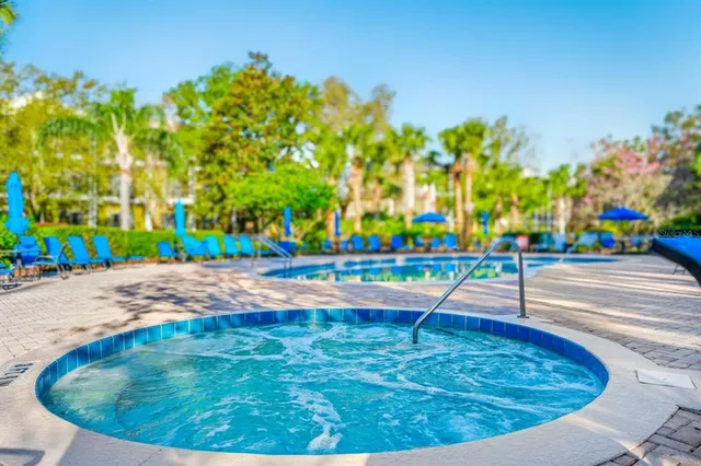 a view of a swimming pool with a patio