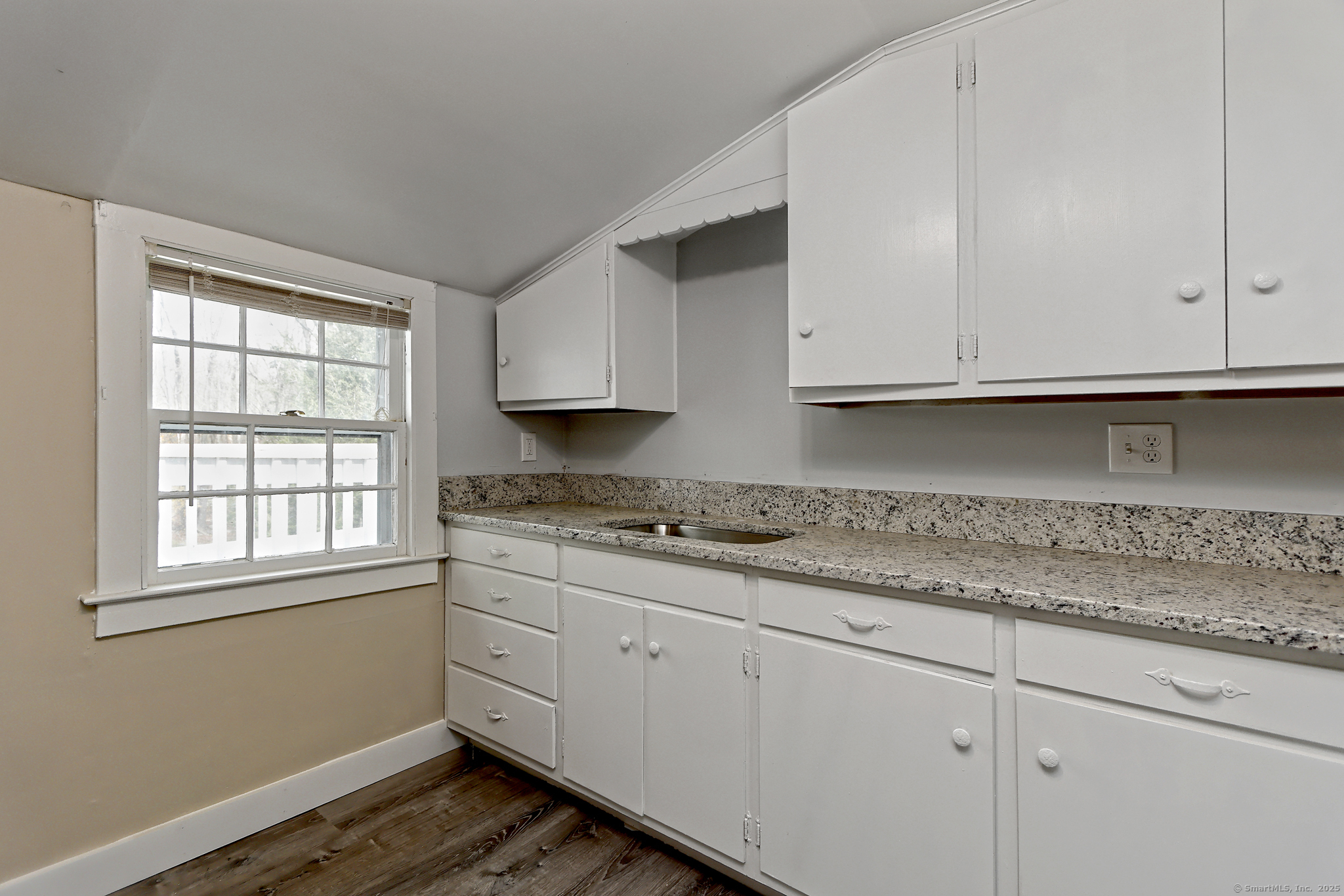 562 Amity Road, Unit D Bethany, CT 06524 - Photo 14 of 40 a kitchen with granite countertop white cabinets and a stove