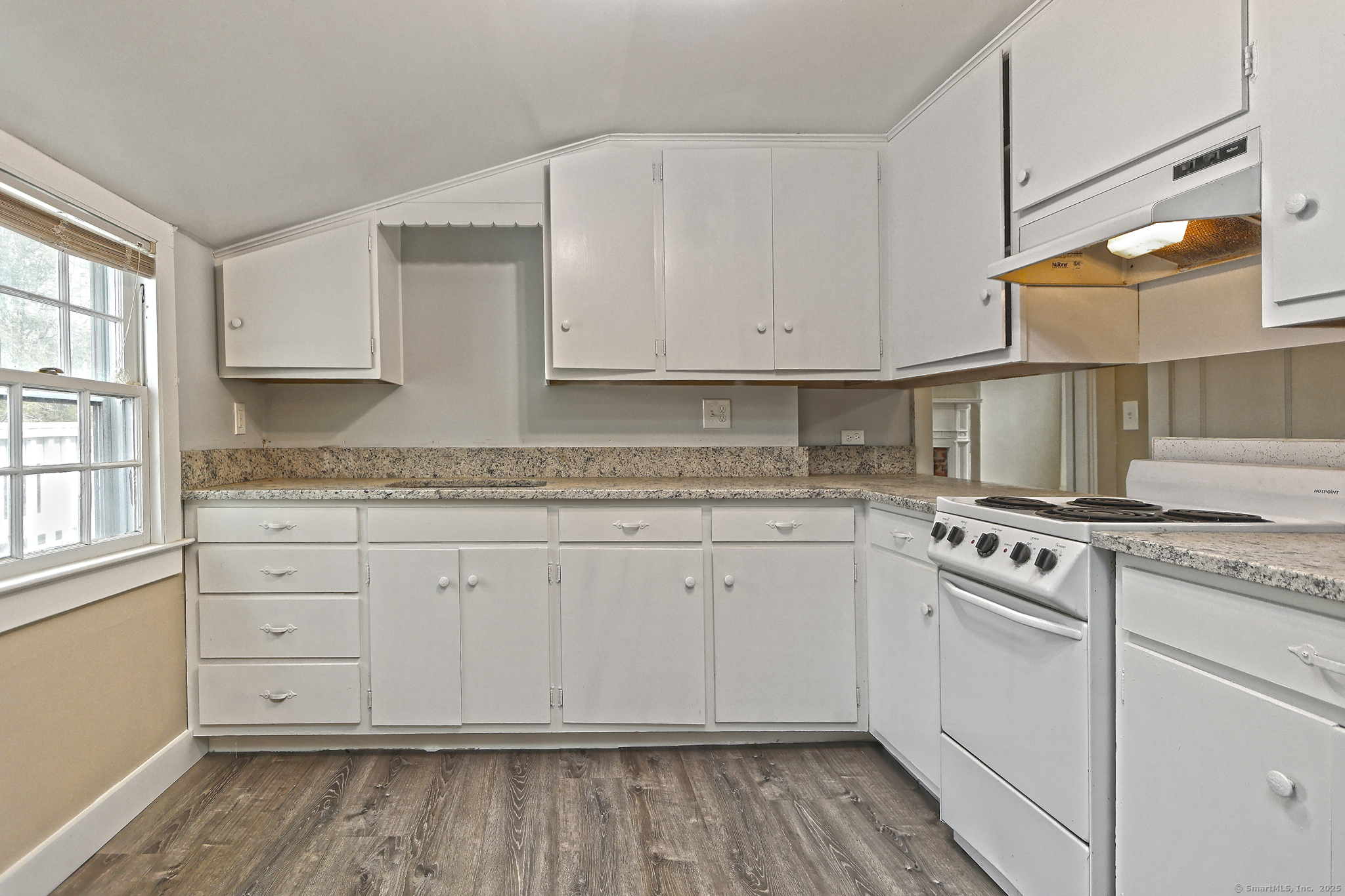 562 Amity Road, Unit D Bethany, CT 06524 - Photo 15 of 40 a kitchen with granite countertop cabinets stainless steel appliances and a sink