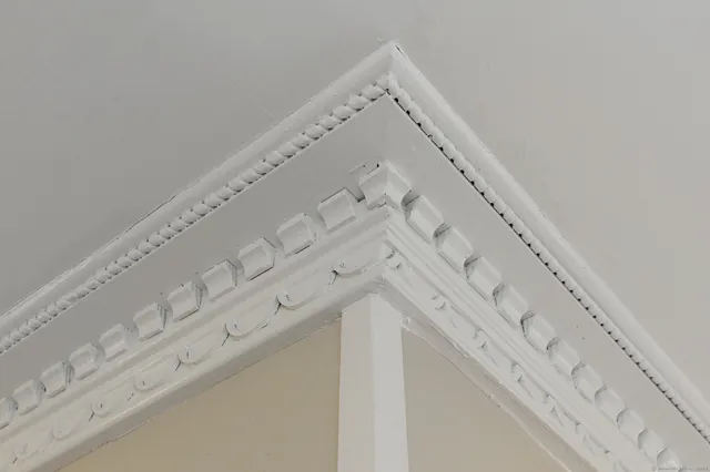a kitchen with granite countertop a sink and refrigerator