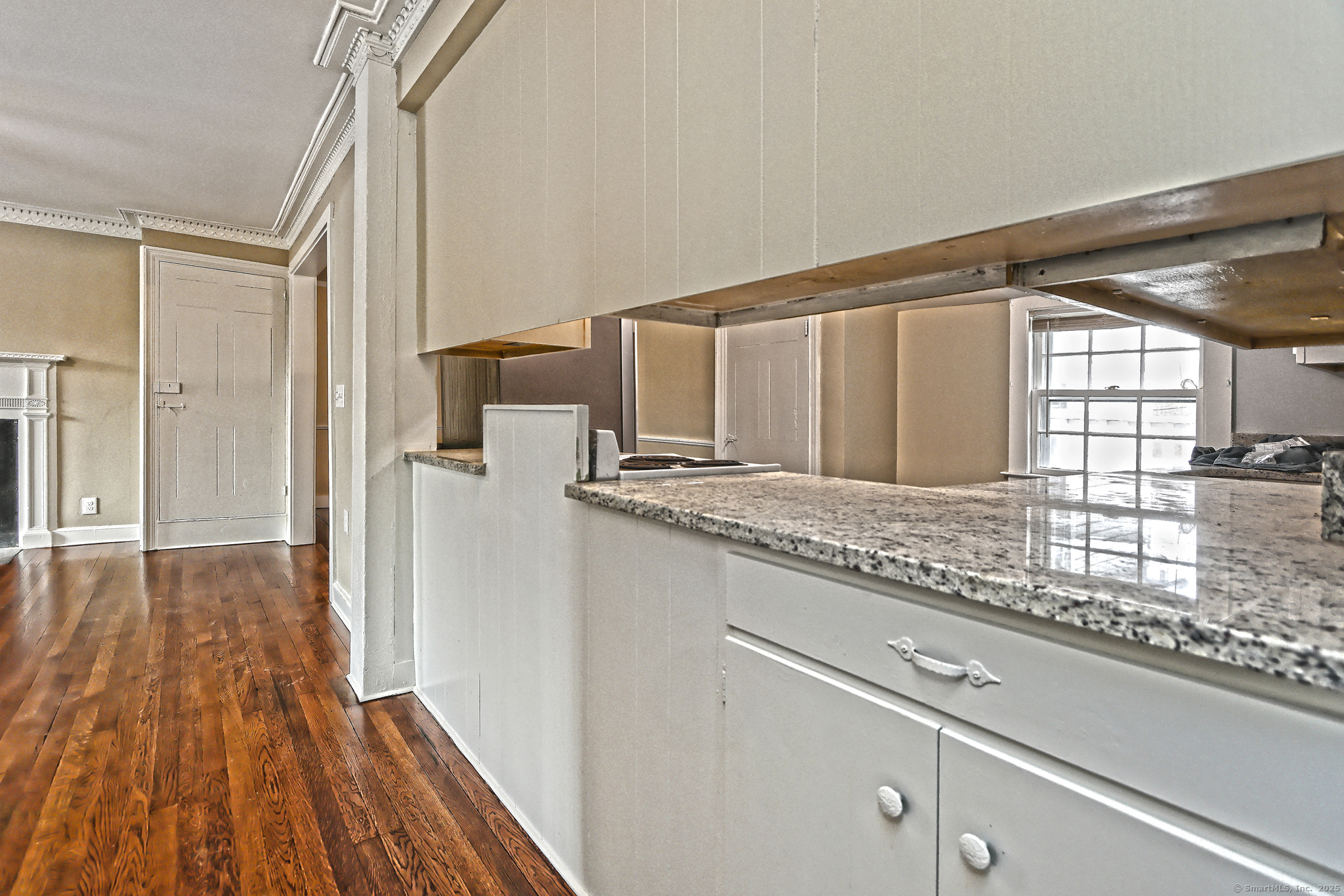 562 Amity Road, Unit D Bethany, CT 06524 - Photo 27 of 40 a kitchen with granite countertop a sink and refrigerator