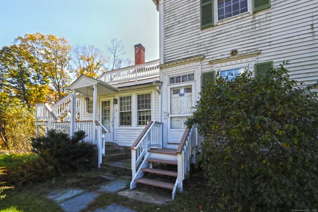 a front view of a house with stairs