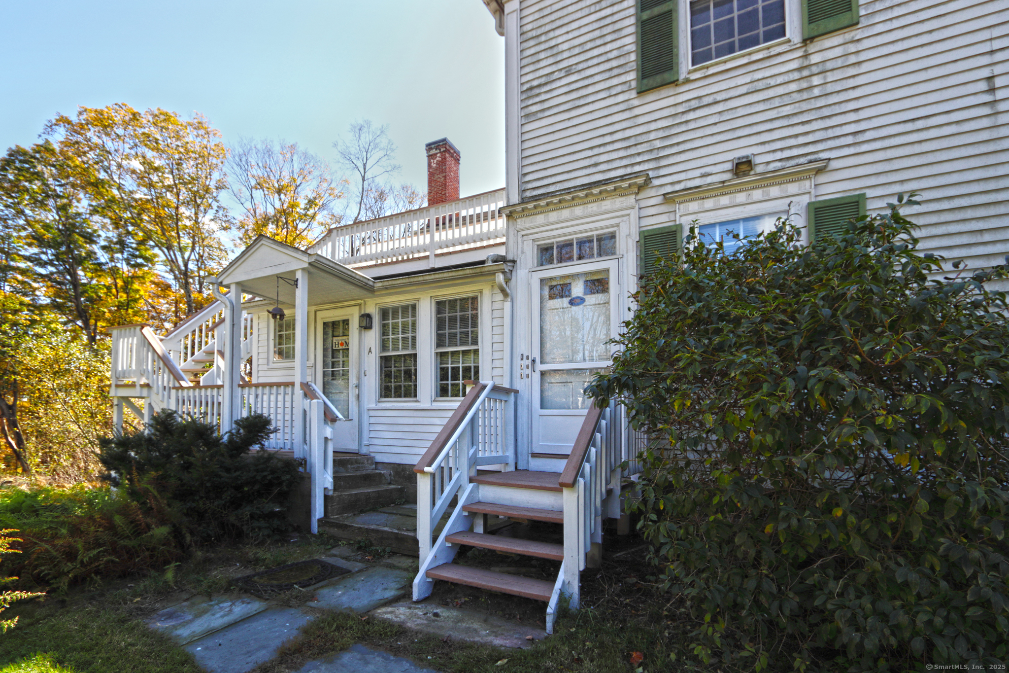 562 Amity Road, Unit D Bethany, CT 06524 - Photo 3 of 40 a front view of a house with stairs