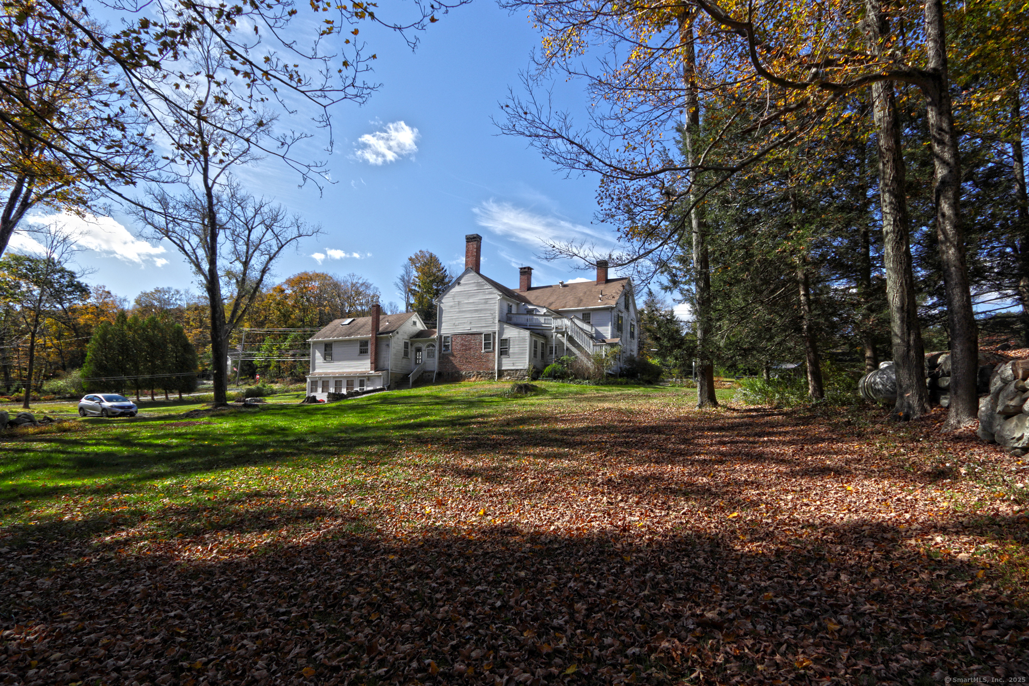562 Amity Road, Unit D Bethany, CT 06524 - Photo 35 of 40 a view of a house with a yard