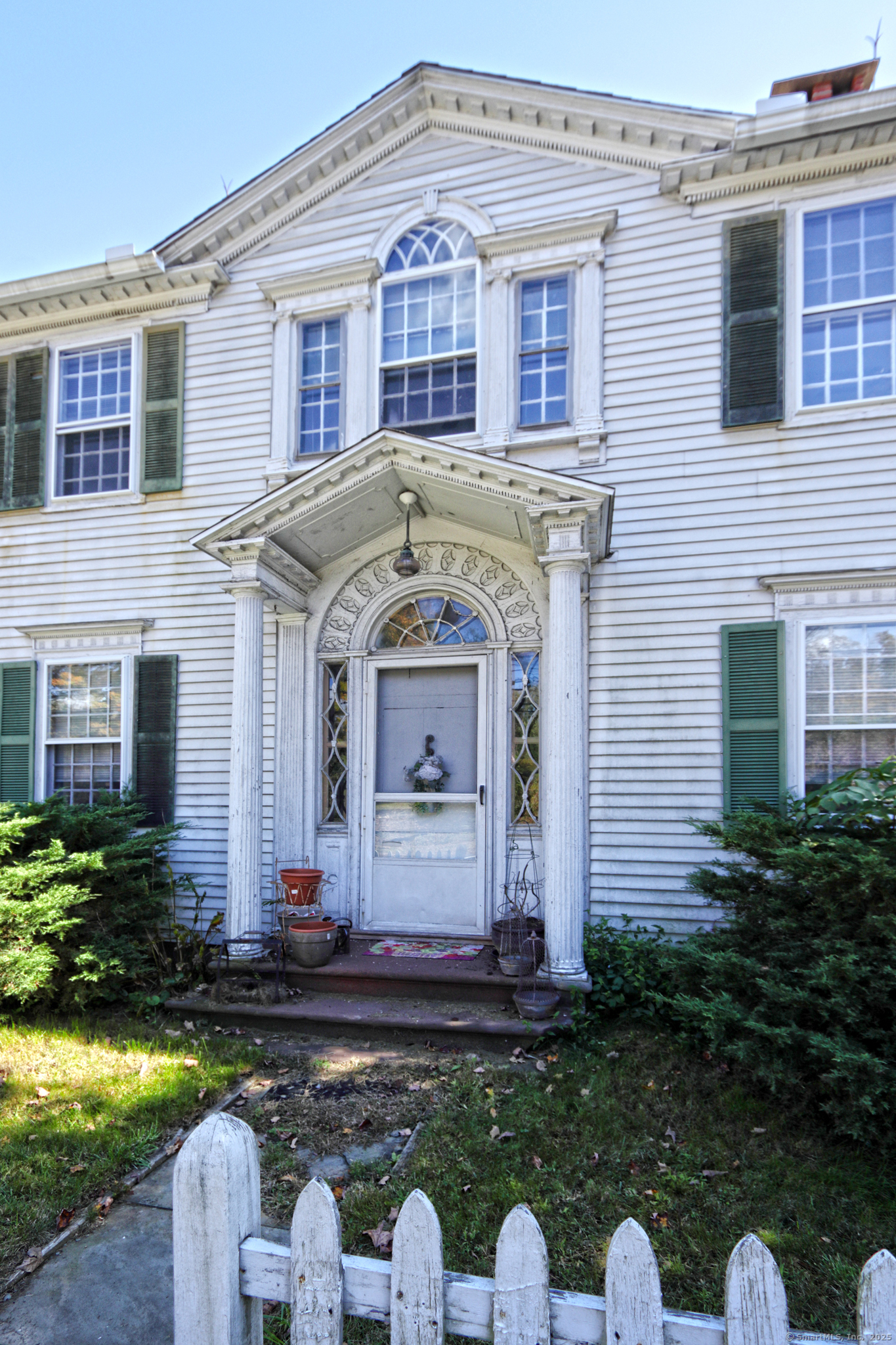 562 Amity Road, Unit D Bethany, CT 06524 - Photo 37 of 40 a front view of a house with garden