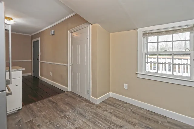 a view of an empty room with a window