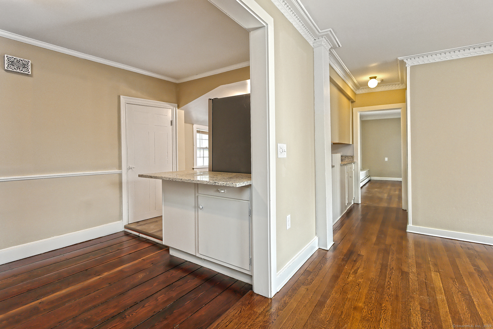 562 Amity Road, Unit D Bethany, CT 06524 - Photo 8 of 40 a view of a hallway with wooden floor