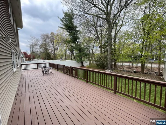 a view of balcony with deck and outdoor space